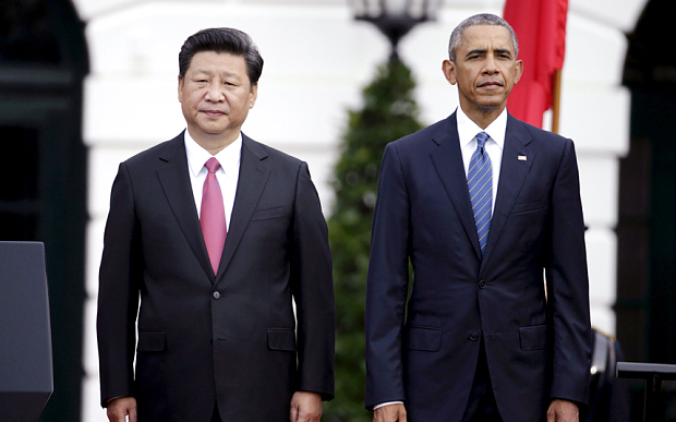 U.S. President Obama stands with Chinese President Xi during arrival ceremony at the White House in Washington
